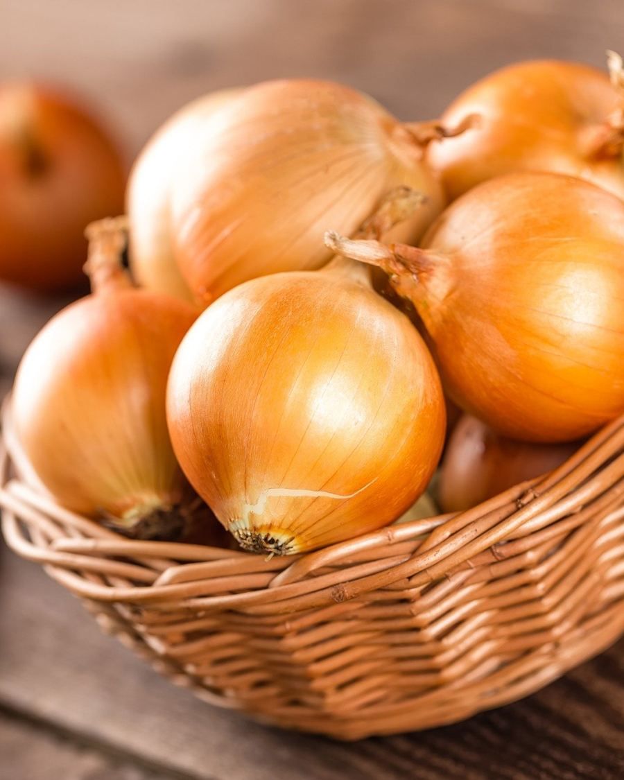 Whole sweet onions in a basket